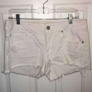 White jean distressed shorts